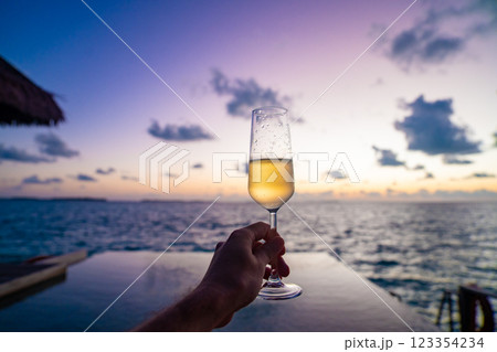 Sunset views from overwater pool villa in Maldives Sunset views from overwater pool villa in Maldives 123354234