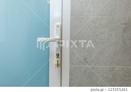 Contemporary Modern Door and Handle Design Featuring a Stylish Textured Wall Background Contemporary Modern Door and Handle Design Featuring a Stylish Textured Wall Background 123355261