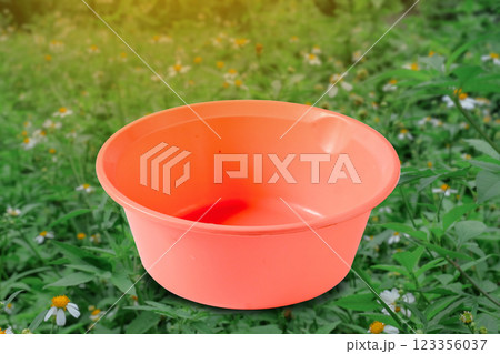 Plastic empty Pink basin or washing up bowl on background. 123356037