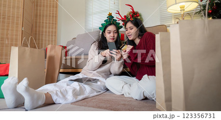 Lesbian Partners Evaluating Gift Options Financial Management Concept in Holiday Shopping 123356731