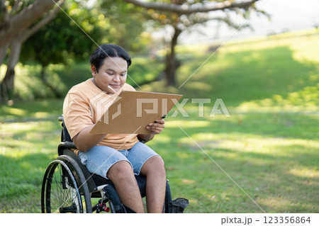 Disabled Artist Absorbing Nature for Art Inspiration on a Sunny Day 123356864