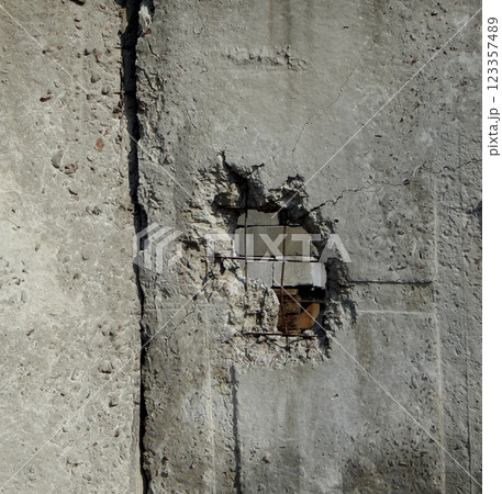 Wound In Concrete Wall After Artillery Fire  123357489