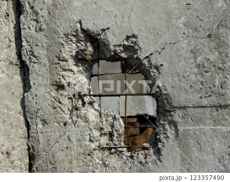 Cannon Shell In Broken Concrete Fence 123357490