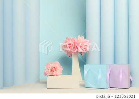 Stage for product display and business concept for shopping advertising.Empty premium podium with gift boxes. Beautiful floral arrangement with peony flowers, elegant beauty concept, Minimal modern 123358021