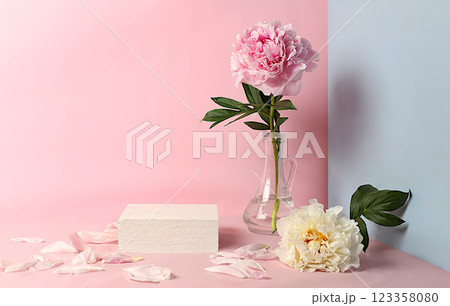 Minimal floral composition.Abstract background with empty podium and peonies flowers,empty showcase for display or presentation of cosmetic products,postcard with place for text,selective focus Minimal floral composition.Abstract background with empty podium and peonies flowers,empty showcase for display or presentation of cosmetic products,postcard with place for text,selective focus 123358080