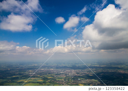 beautiful thick clouds in the sky from the height of the flight of the plane with a view of the continent and countries beautiful thick clouds in the sky from the height of the flight of the plane with a view of the continent and countries 123358422