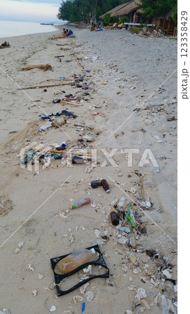 a lot of garbage on the sandy sea beach a lot of garbage on the sandy sea beach 123358429