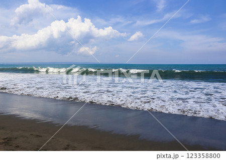 beautiful landscape on the coast of the beach and sea waves against the background of the blue sky 123358800