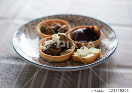 a delicious dish of cooked snails on a plate a delicious dish of cooked snails on a plate 123359208
