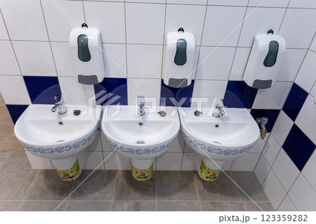 Discover Modern Bathroom Amenities featuring stylish Sinks, Dispensers, and more 123359282