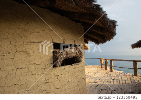 mud houses bungalow on the shore of the lake mud houses bungalow on the shore of the lake 123359495