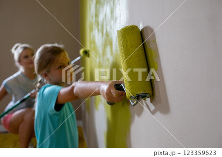 Children Engage in Painting Walls Collaboratively, Using a Variety of Bright Colors and Fun 123359623