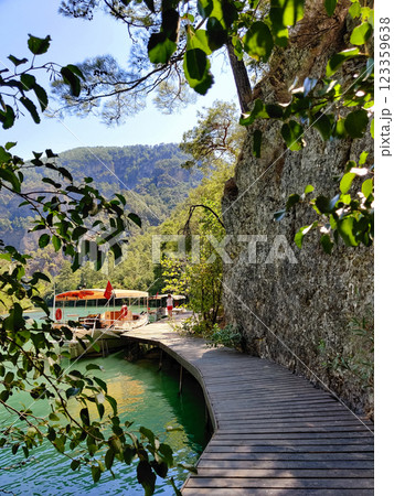 beautiful ships and boats are moored near the shore beautiful ships and boats are moored near the shore 123359638