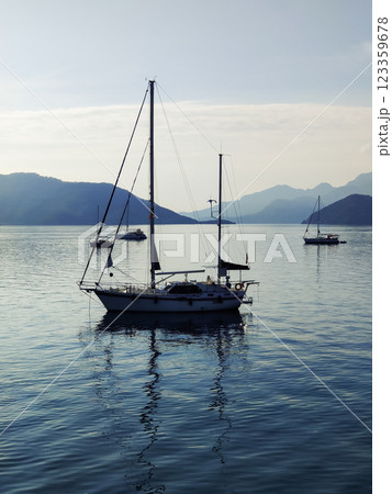 beautiful ships and boats are moored near the shore beautiful ships and boats are moored near the shore 123359678