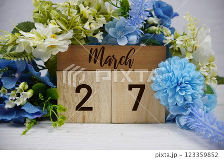 Wooden Calendar Showing the Date of March 27th. Day 27 of March month 123359852