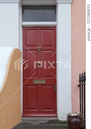 Closed red door 123360033