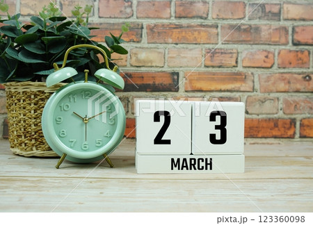 Wooden Calendar Showing the Date of March 23th. Day 23 of March month 123360098