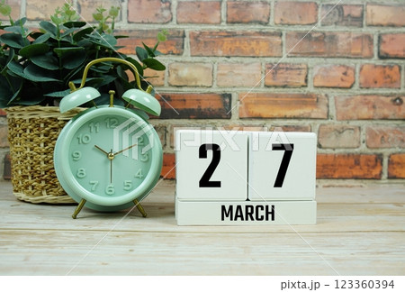 Wooden Calendar Showing the Date of March 27th. Day 27 of March month 123360394