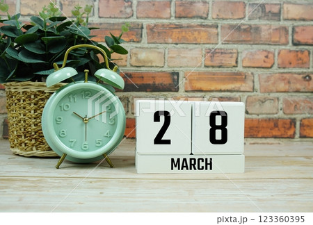 Wooden Calendar Showing the Date of March 28th. Day 28 of March month 123360395