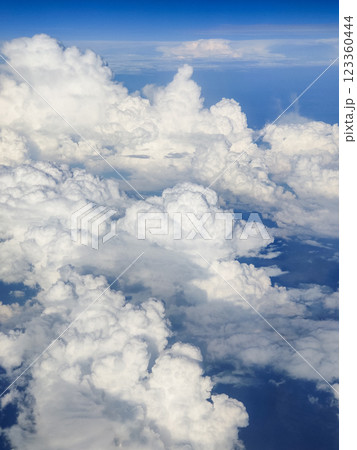 beautiful thick clouds in the sky from the height of the plane 123360444