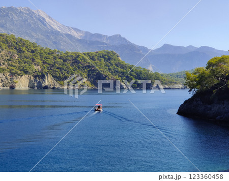 a beautiful ship is sailing in the blue sea 123360458