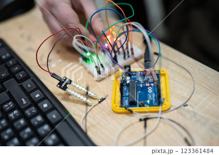 an engineer is engaged in the development and layout of electrical circuits 123361484