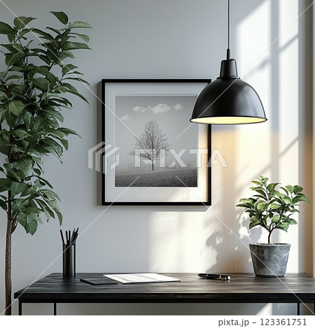 Modern workspace with minimalistic decor featuring plants, artwork, and natural light 123361751