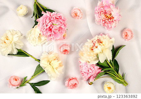 Abstract floral arrangement, flat lay, beautiful peonies on an elegant background, spring and summer banner. Creative modern bouquet. Mother's Day card, happy birthday, wedding, holiday concept with Abstract floral arrangement, flat lay, beautiful peonies on an elegant background, spring and summer banner. Creative modern bouquet. Mother's Day card, happy birthday, wedding, holiday concept with 123363892