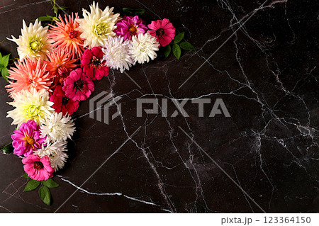 Abstract floral arrangement. Beautiful autumn banner with dahlias, gerberas and asters on dark marble background, holiday card, seasonal still life Hello, autumn , frame of seasonal flowers,. 123364150
