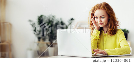 Working At Home Concept. Smiling young curly female manager typing on computer, doing remote job, copy space 123364861