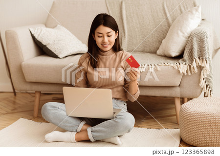 Online Payment. Girl Holding Credit Card and Using Laptop for Shopping in Internet at Home, Copy Space Online Payment. Girl Holding Credit Card and Using Laptop for Shopping in Internet at Home, Copy Space 123365898