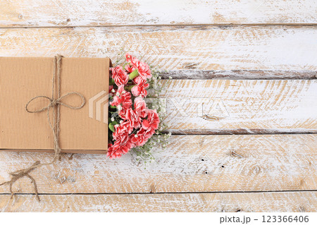 Carnations in a box, abstract spring floral background. Creative modern bouquet, minimal holiday concept. Postcard for womens day or mothers day, happy birthday, wedding, banner for the screen, Carnations in a box, abstract spring floral background. Creative modern bouquet, minimal holiday concept. Postcard for womens day or mothers day, happy birthday, wedding, banner for the screen, 123366406