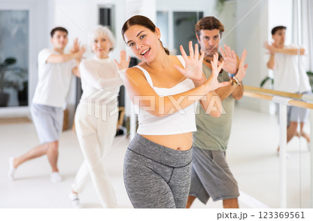 Active sports people learning how to dance modern dances in dance studio Active sports people learning how to dance modern dances in dance studio 123369561