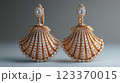 Golden seashell earrings with diamonds 123370015