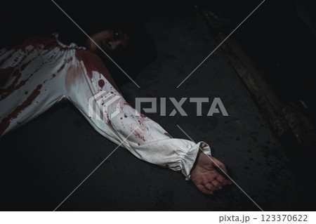 Closeup hand with blood of horror bloodthirsty ghost woman on floor Closeup hand with blood of horror bloodthirsty ghost woman on floor 123370622