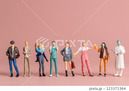 Miniature figurines of women representing diverse professions ,A perfect visual for International Women Day 123371364