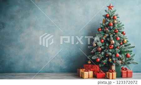 Beautiful Christmas tree with golden baubles and white wrapped presents in a festive holiday setting. Ideal for holiday greetings or cozy backgrounds 123372072