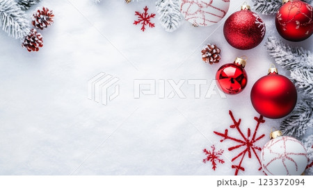 Detailed view of various Christmas ornaments on a snowy backdrop, great for holiday marketing and promotions. 123372094