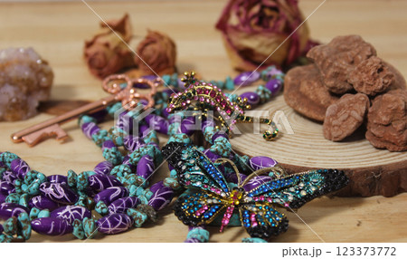 Southwestern Style Jewelry on Wooden Table With Rustic Decor 123373772
