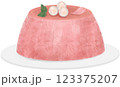 A pudding topped with a pink flower. 123375207
