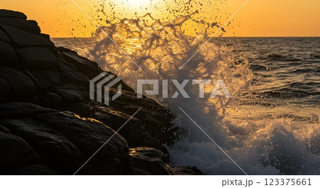 Dramatic ocean wave crashing against rugged rocks at sunset, golden sunlight reflecting on the water, high-speed capture, ultra-detailed, high resolution, cinematic shot, close-up 123375661