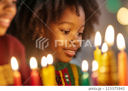 Joyful Child Celebrating Festive Holiday with Colorful Candlelight Warmth ai generative 123375842