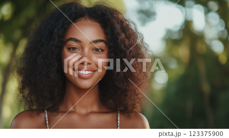 Smiling Woman in Nature with Curly Hair and Green Background ai generative 123375900