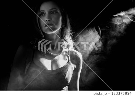 This is a Dramatic Portrait in Black and White featuring a Smoky Background that captivates 123375954