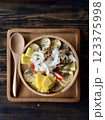Smoothie bowl with bananas, berries, granola and other ingredients 123375998