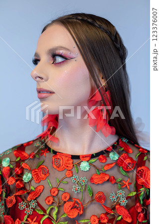 A Vibrant Fashion Portrait that features Stunning Floral Embellishments and Details A Vibrant Fashion Portrait that features Stunning Floral Embellishments and Details 123376007