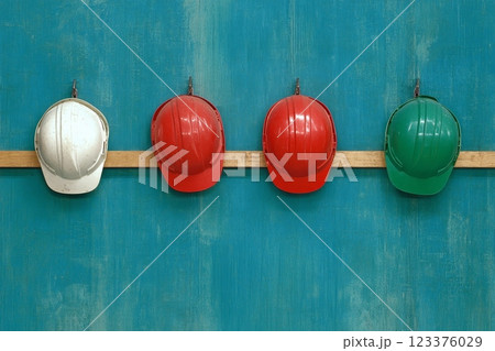Colorful Safety Helmets on Wooden Rail Against Turquoise Wall ai generative ai generative 123376029