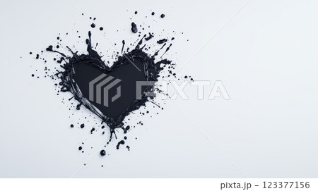 Dynamic black ink splashes forming heart shape on white background 123377156
