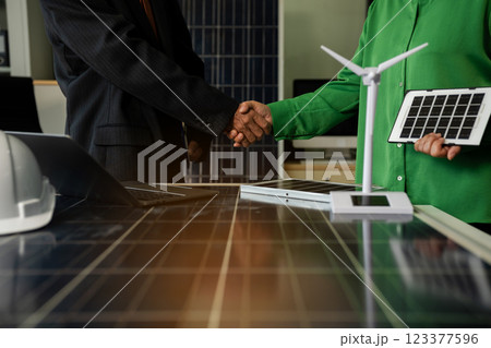 Businessmen shake hands after agreeing to start a new project successfully. 123377596