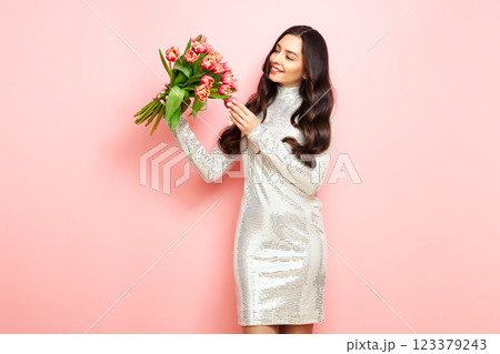 Happy beauty woman with pink tulip bouquet 123379243